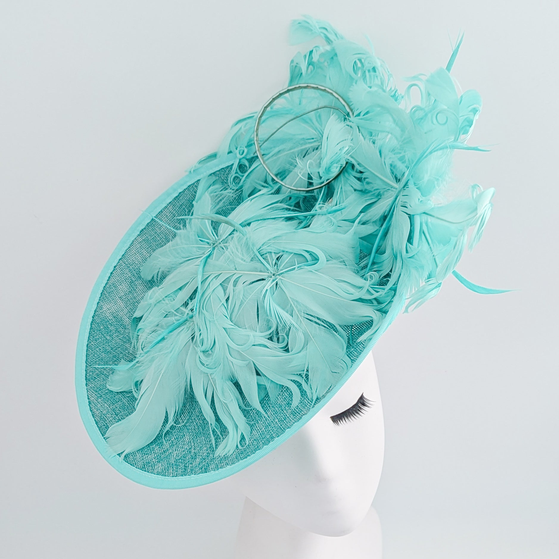 Light turquoise green blue large feather saucer disc fascinator hat