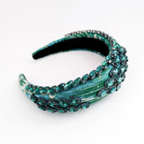 Emerald green crystal padded satin headband fascinator