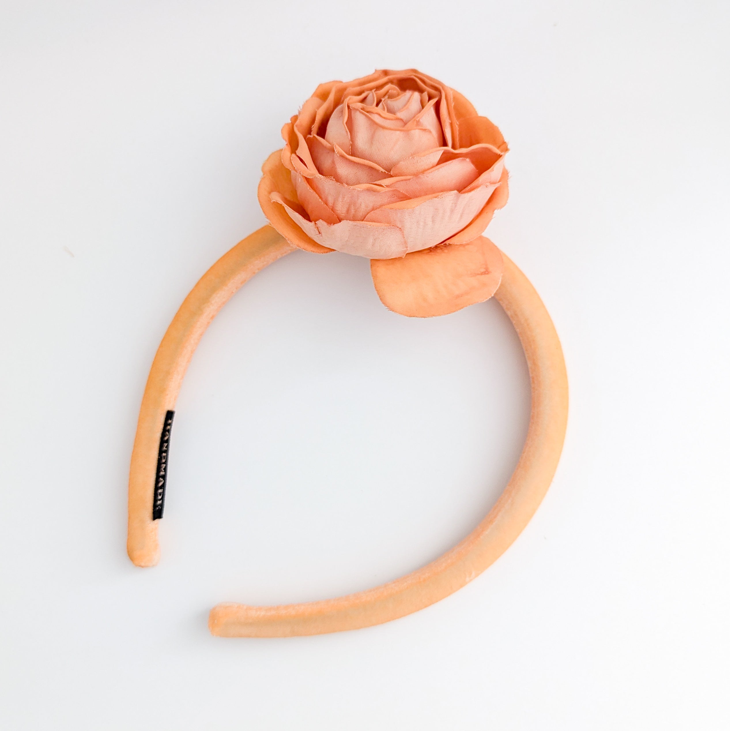 Light orange flower padded velvet headband fascinator