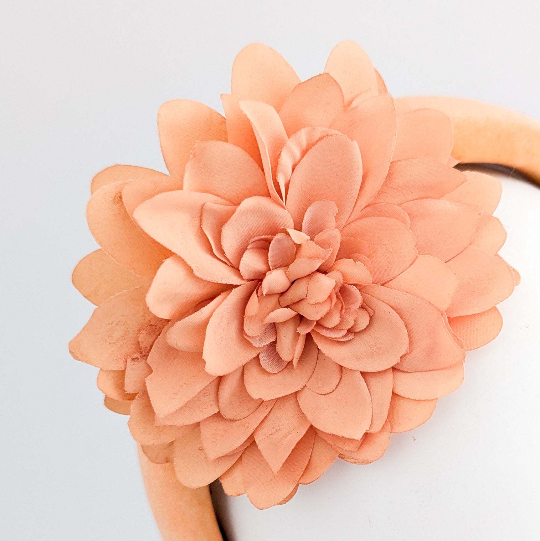 Light orange flower padded velvet headband fascinator