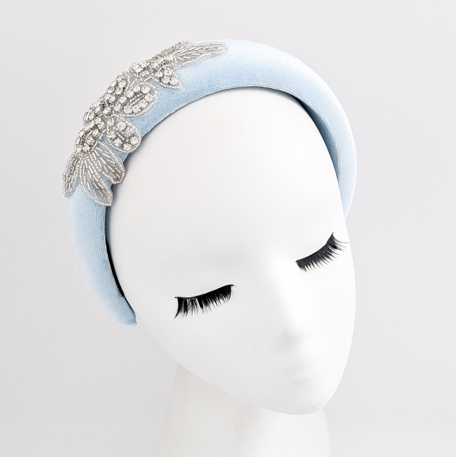 Light baby blue crystal padded velvet headband fascinator