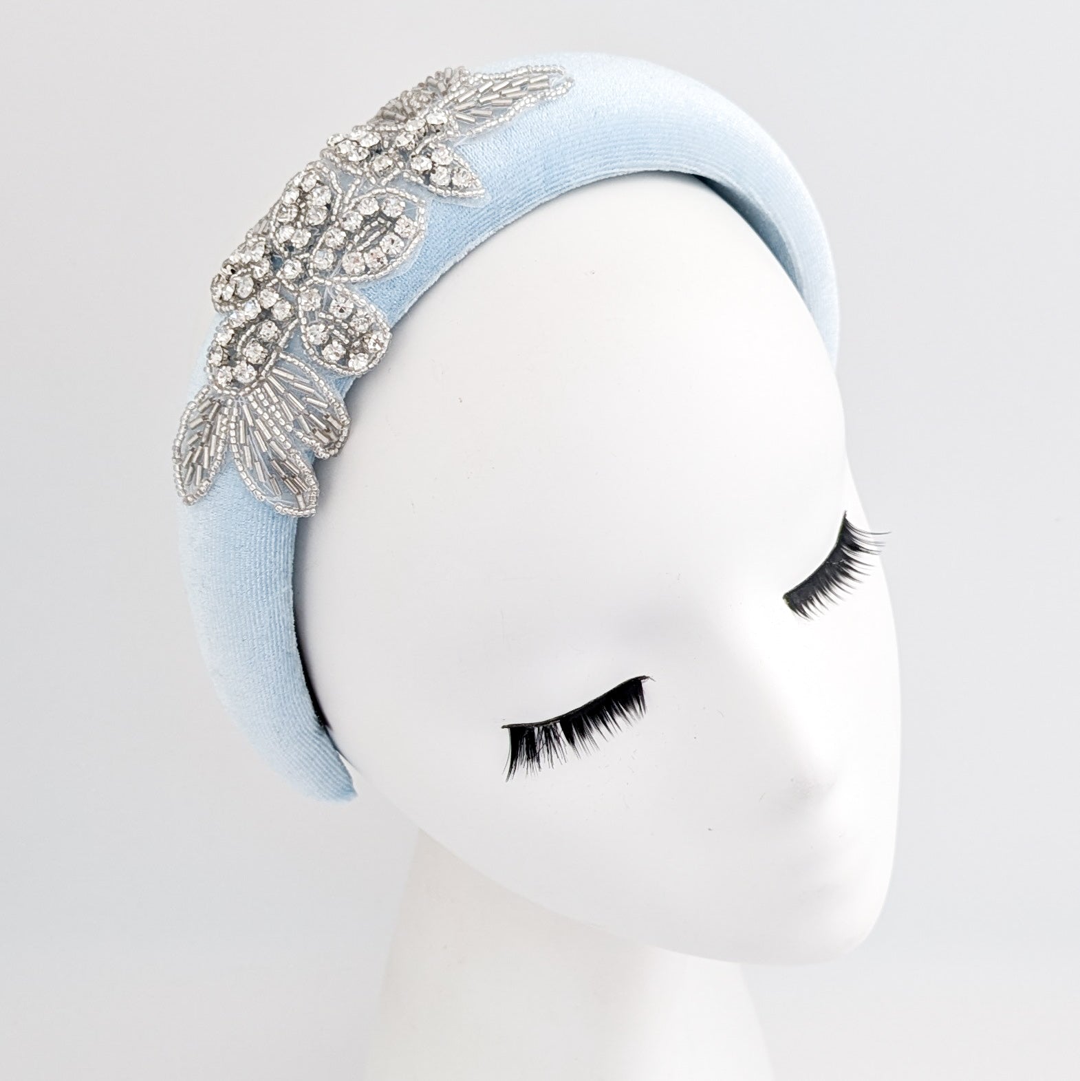Light baby blue crystal padded velvet headband fascinator