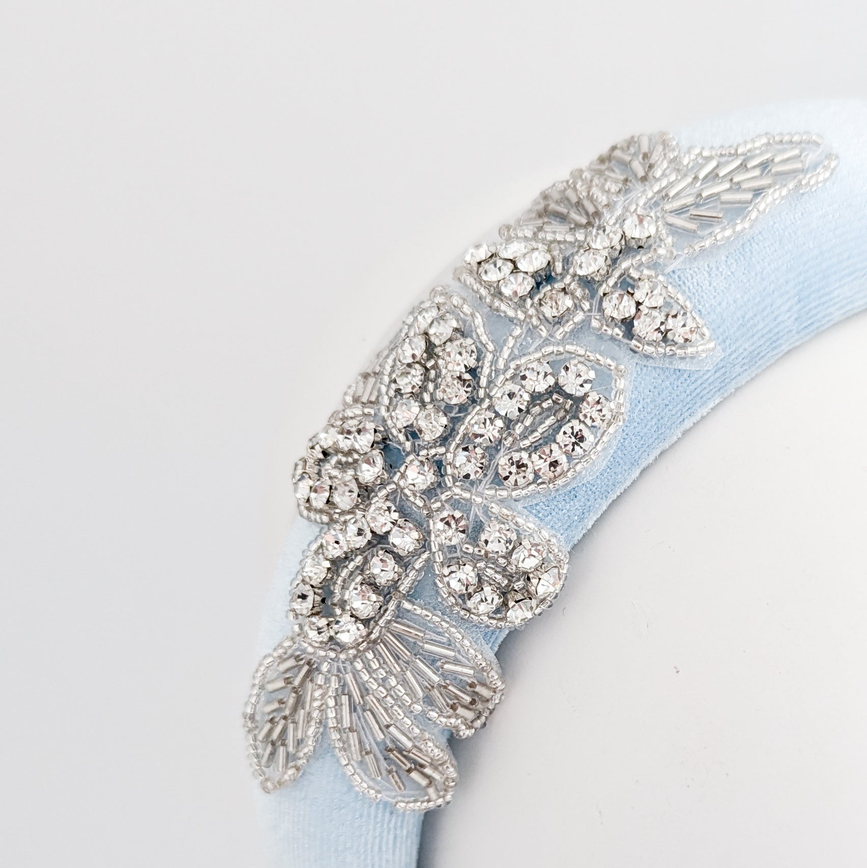 Light baby blue crystal padded velvet headband fascinator