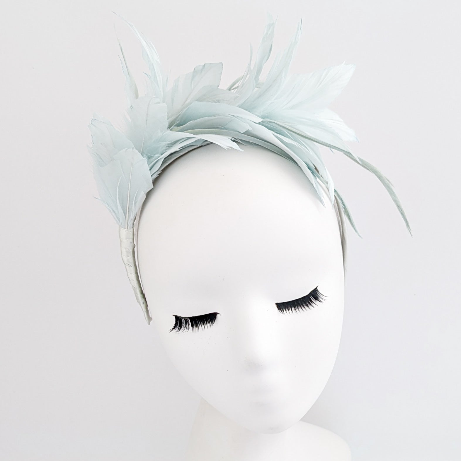 Light aquamarine blue feather satin headband fascinator