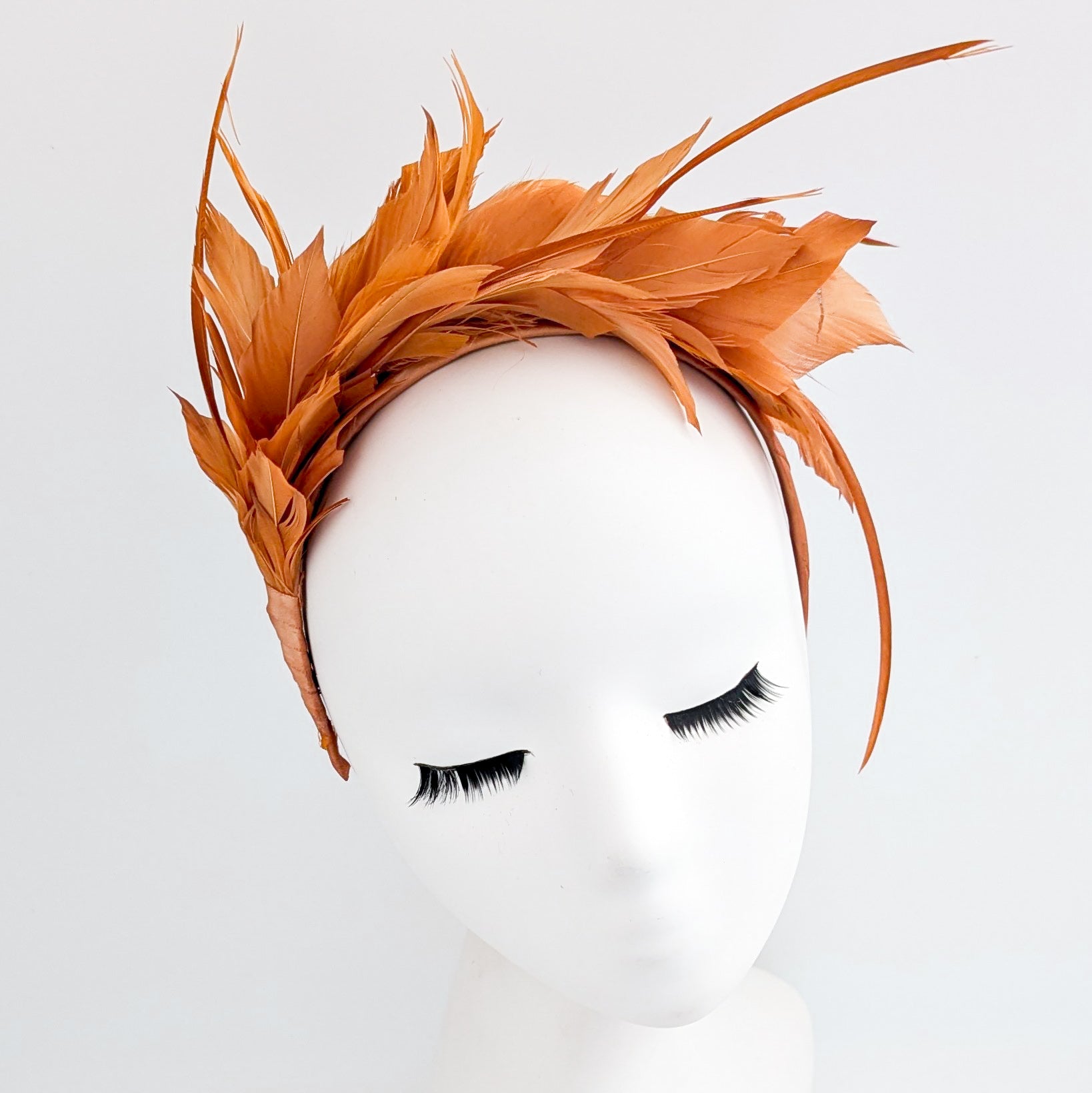Burnt orange feather satin headband fascinator