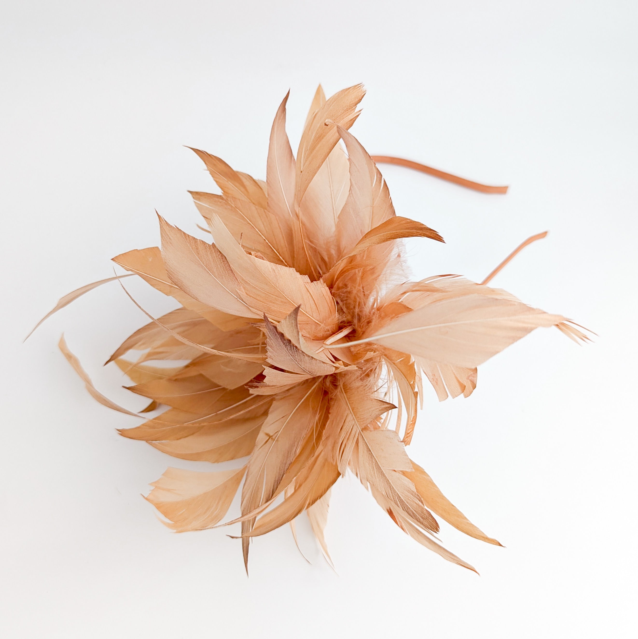 Light orange ombre feather fascinator hat