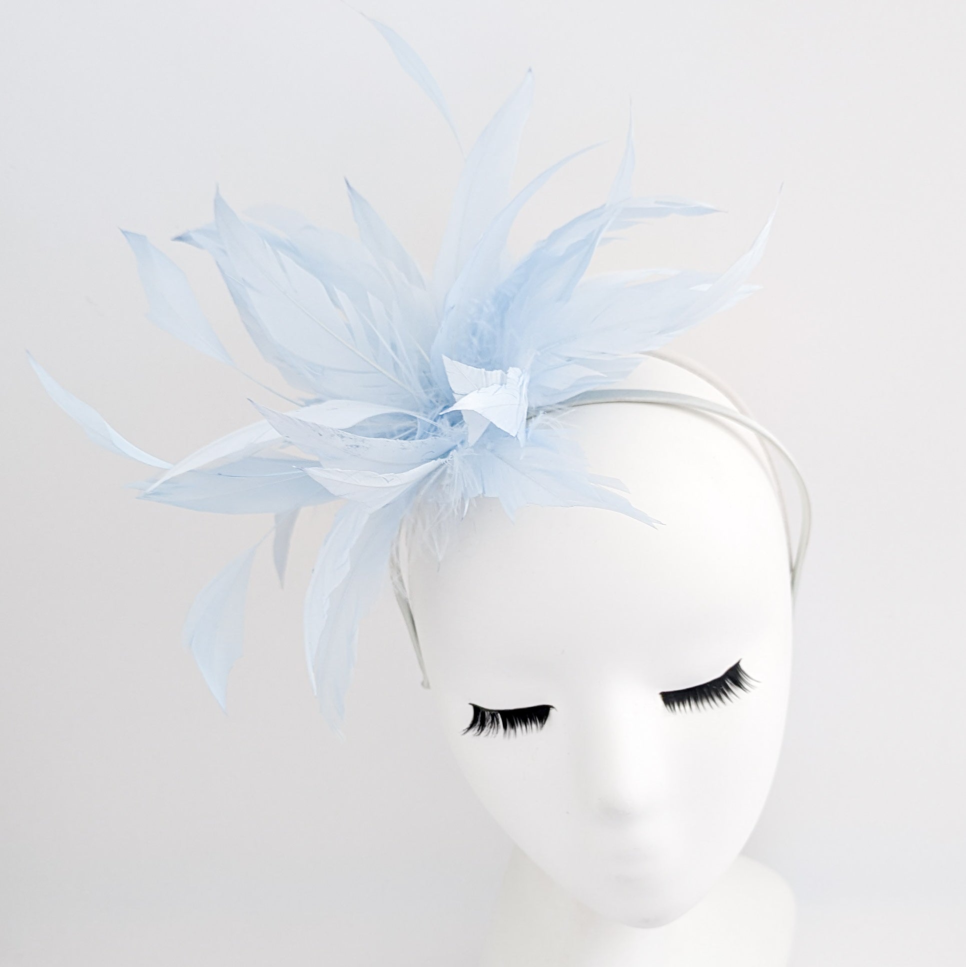 Light baby blue feather fascinator hat