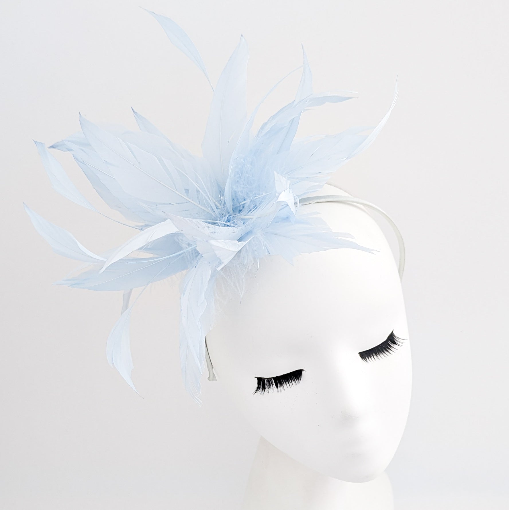 Light baby blue feather fascinator hat