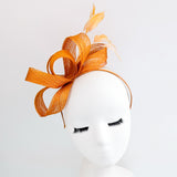 Burnt orange feather fascinator hat