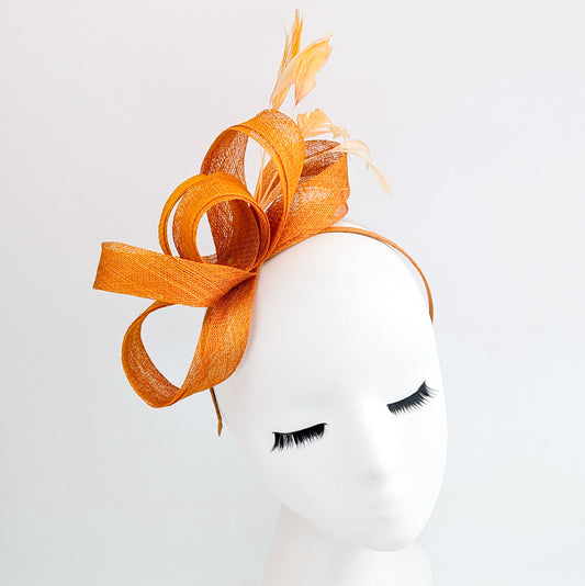Burnt orange feather fascinator hat