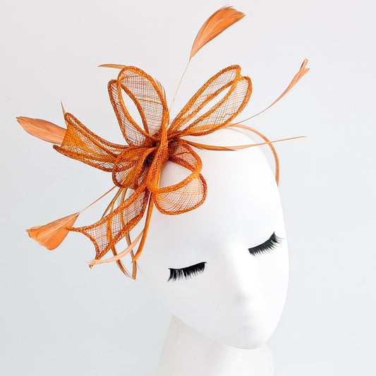 Burnt orange feather fascinator hat