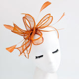 Burnt orange feather fascinator hat