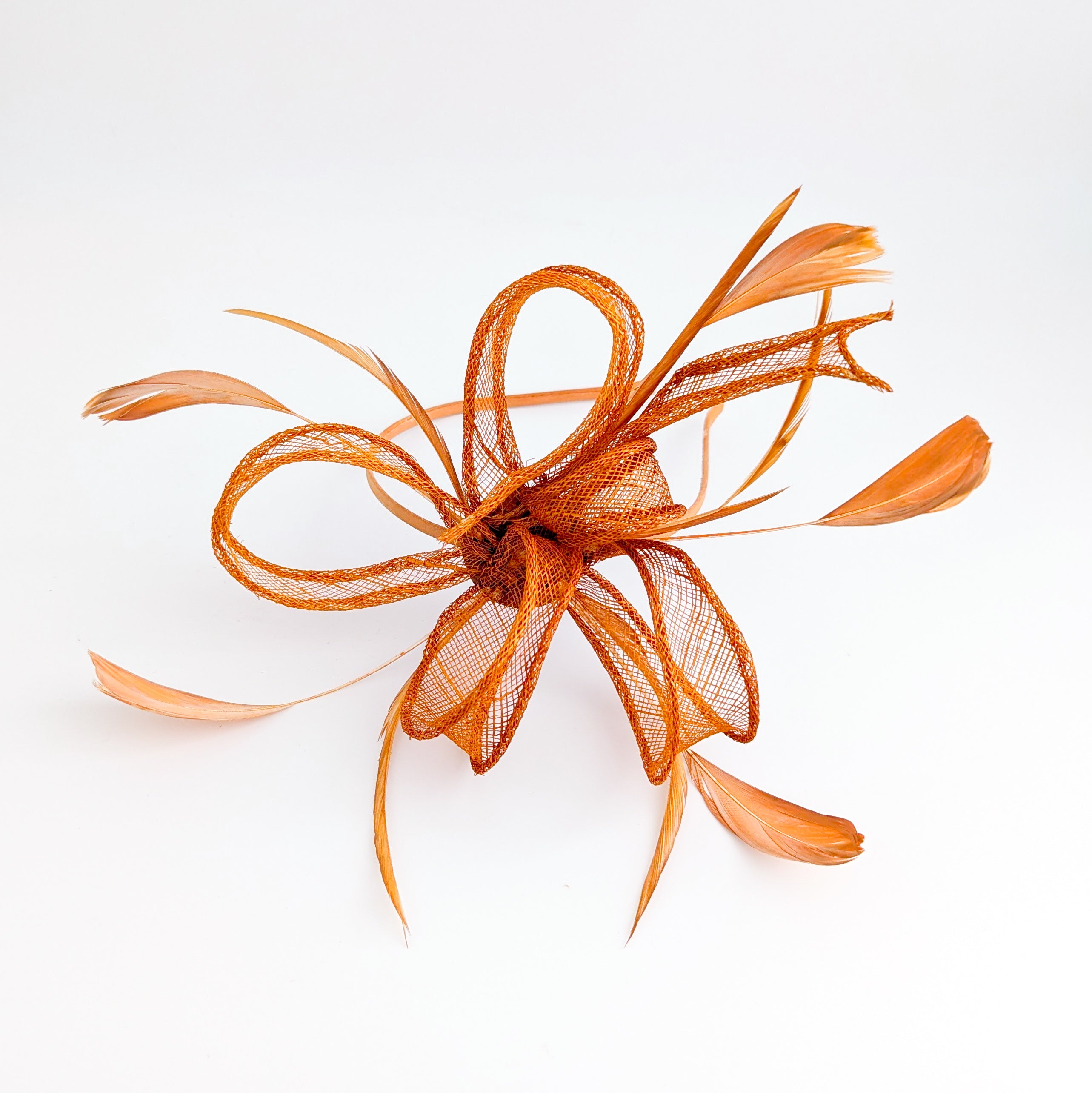 Burnt orange feather fascinator hat