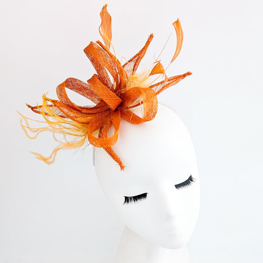 Burnt orange feather fascinator hat