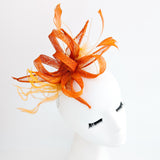 Burnt orange feather fascinator hat