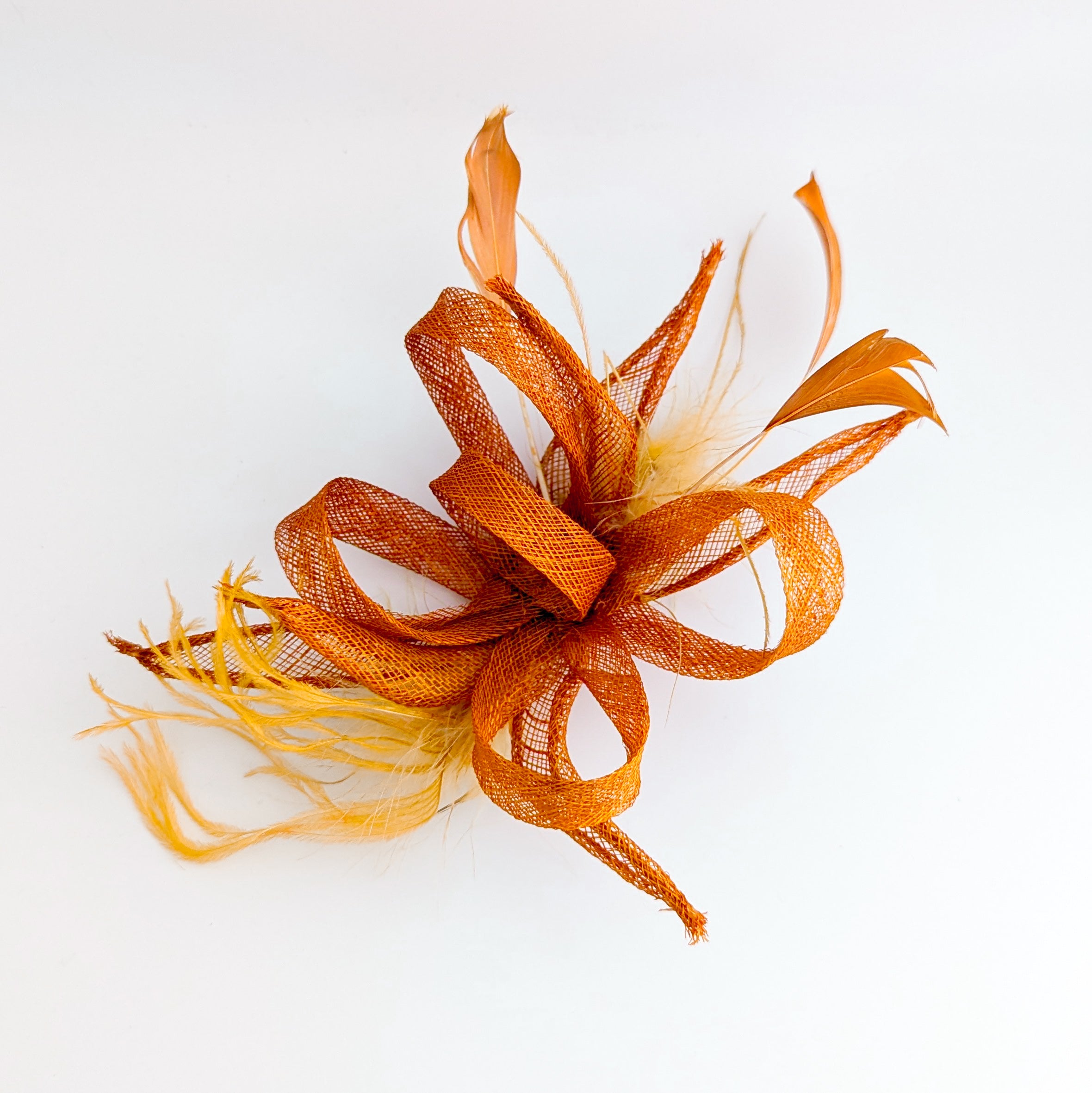 Burnt orange feather fascinator hat