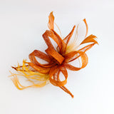 Burnt orange feather fascinator hat