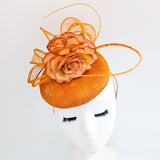Tangerine orange flower fascinator hat