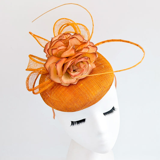 Tangerine orange flower fascinator hat