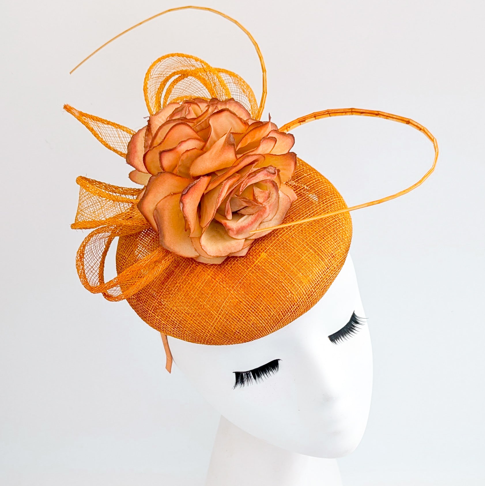 Tangerine orange flower fascinator hat