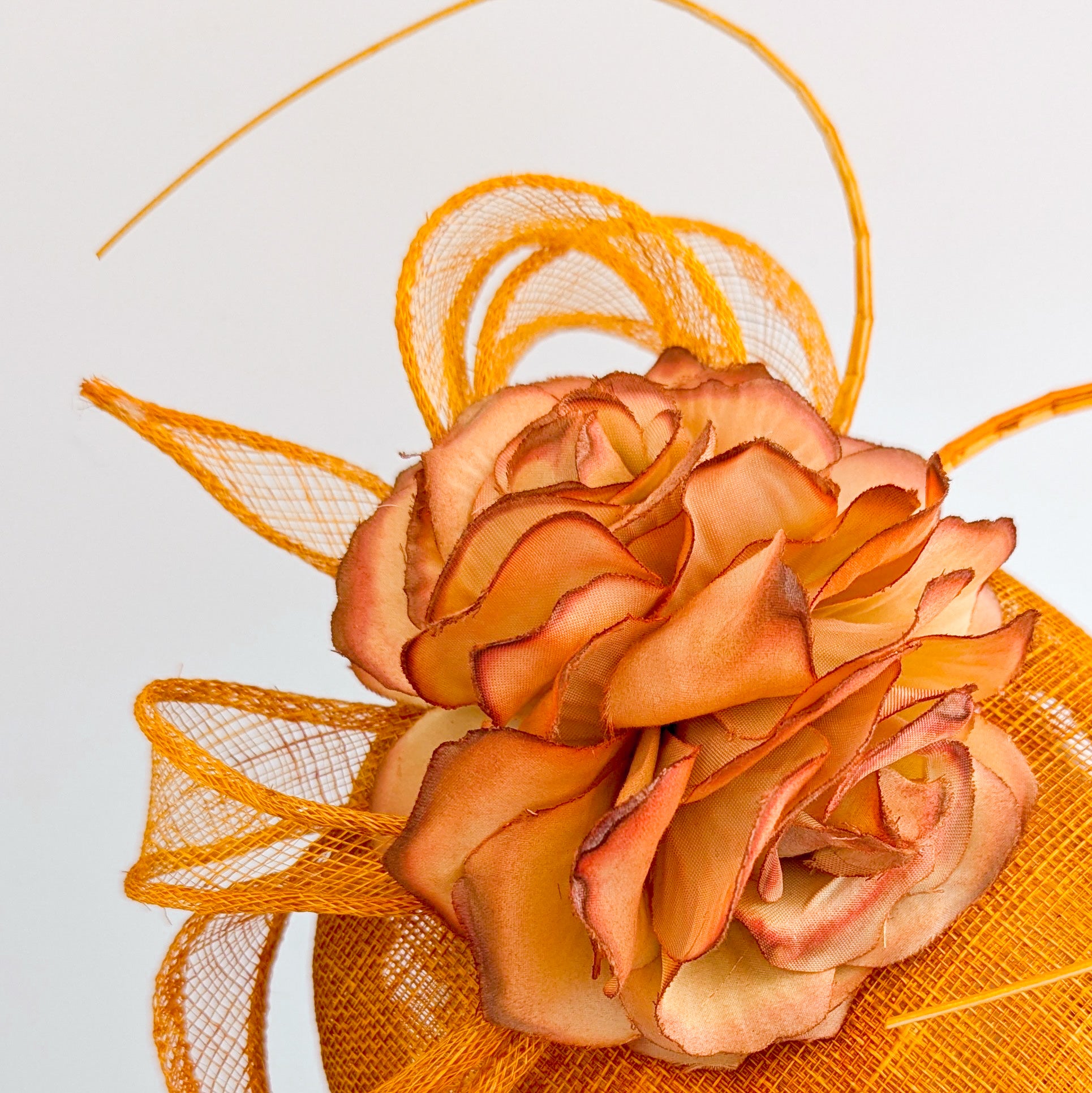 Tangerine orange flower fascinator hat