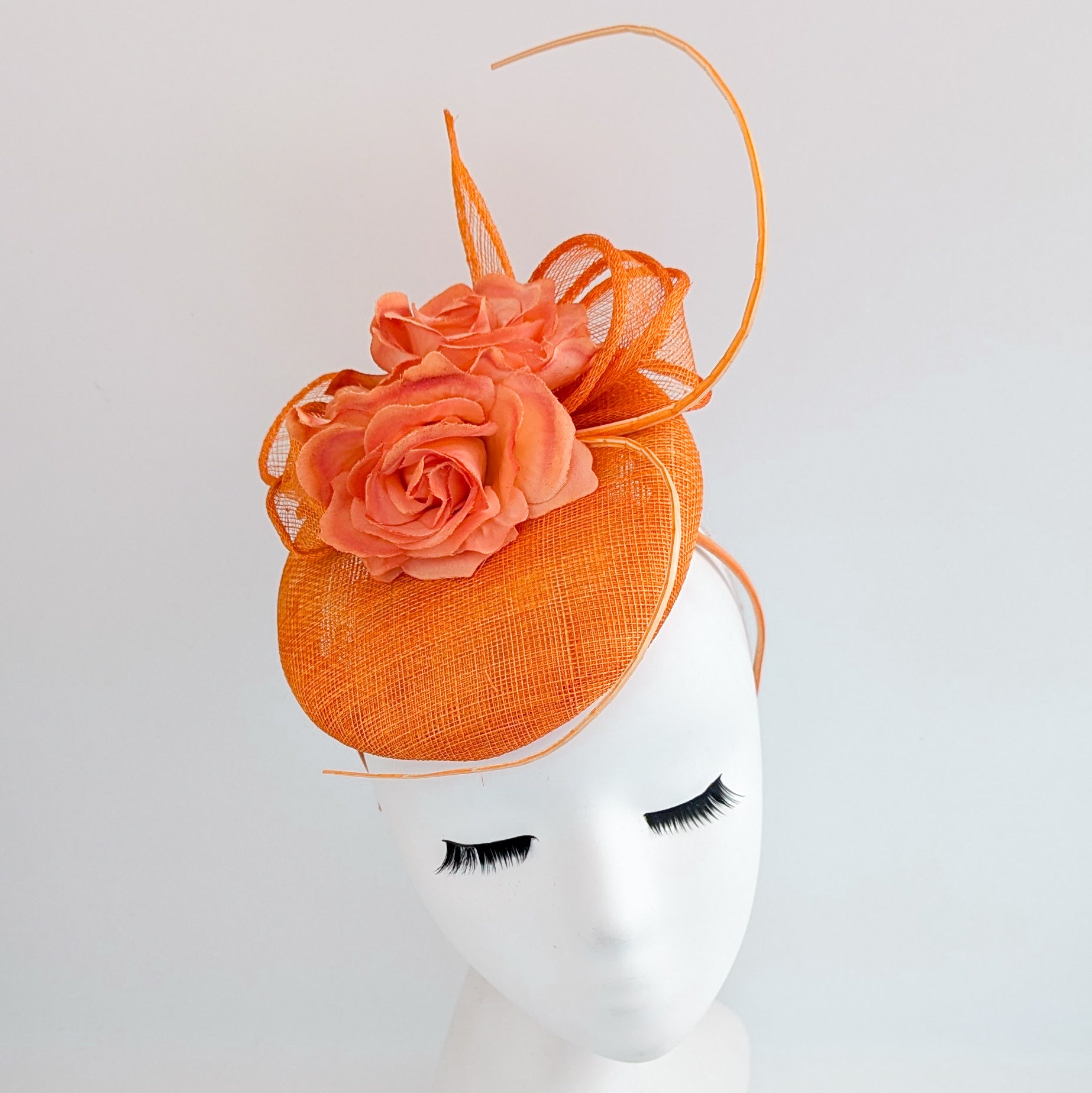 Bright orange coral flower fascinator hat