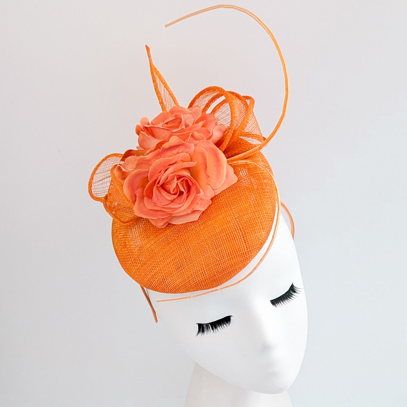 Bright orange coral flower fascinator hat