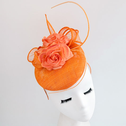 Bright orange coral flower fascinator hat