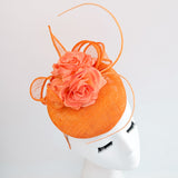 Bright orange coral flower fascinator hat