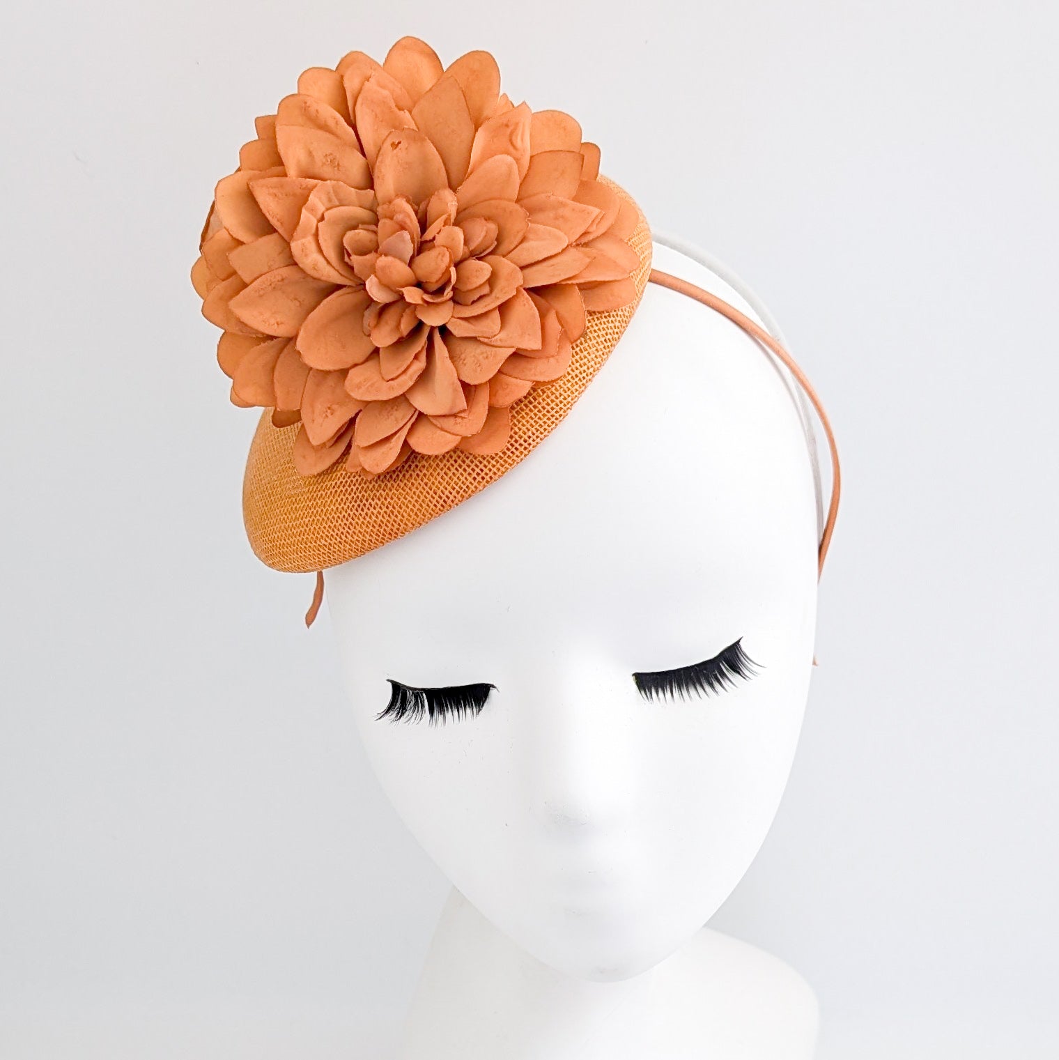 Light orange flower fascinator hat