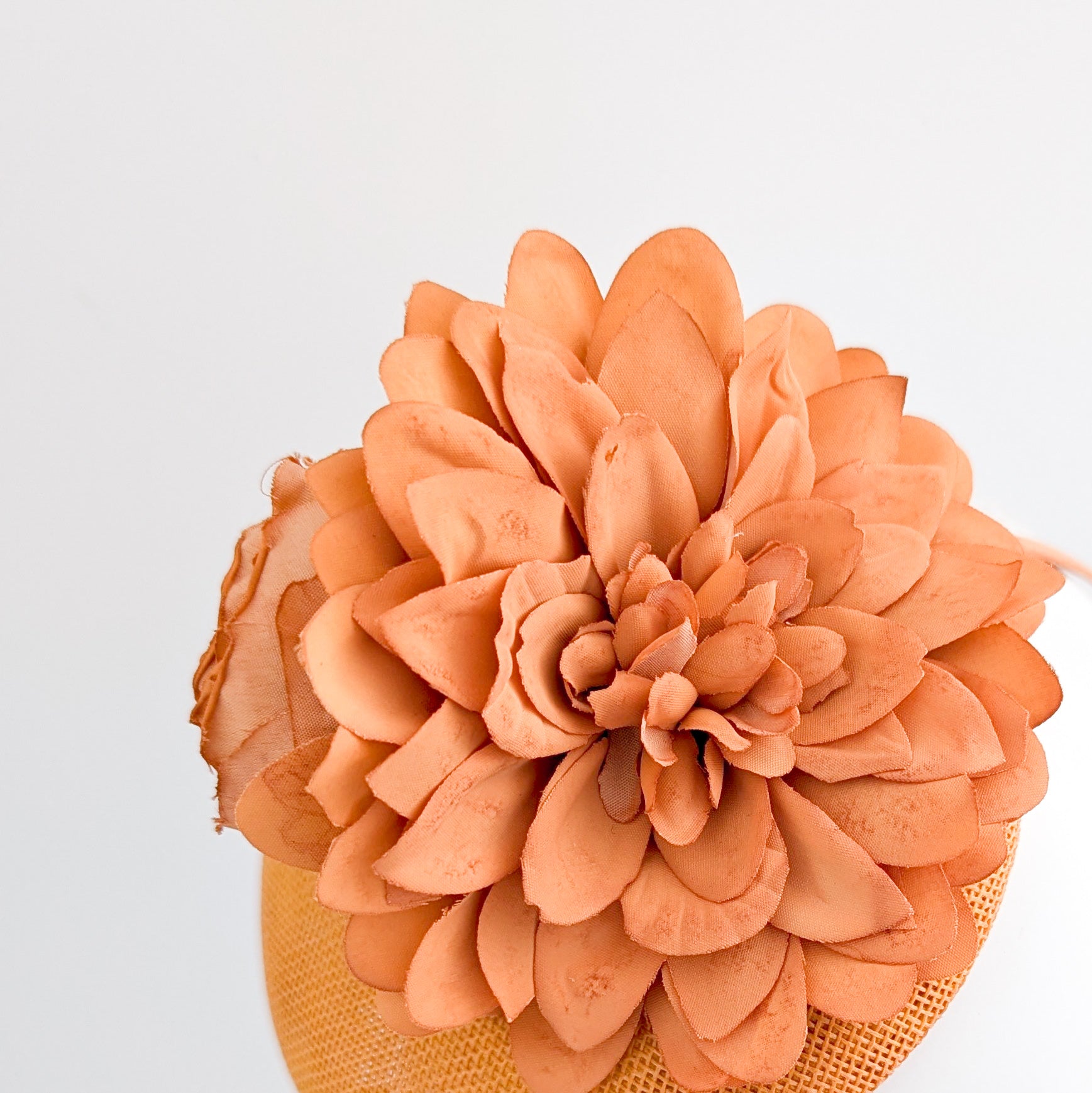 Light orange flower fascinator hat