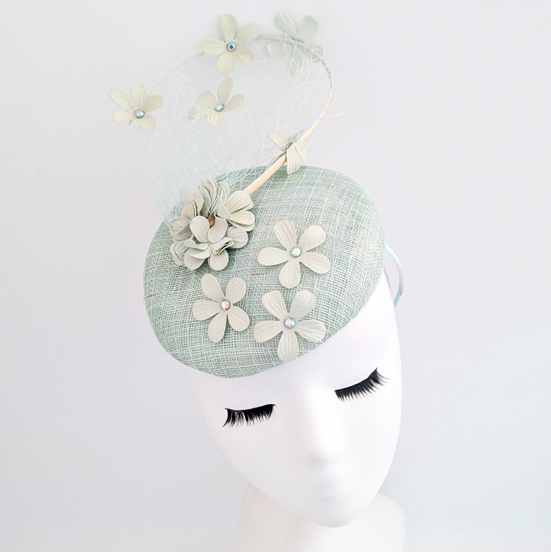 Light aquamarine blue flower fascinator hat