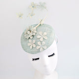 Light aquamarine blue flower fascinator hat