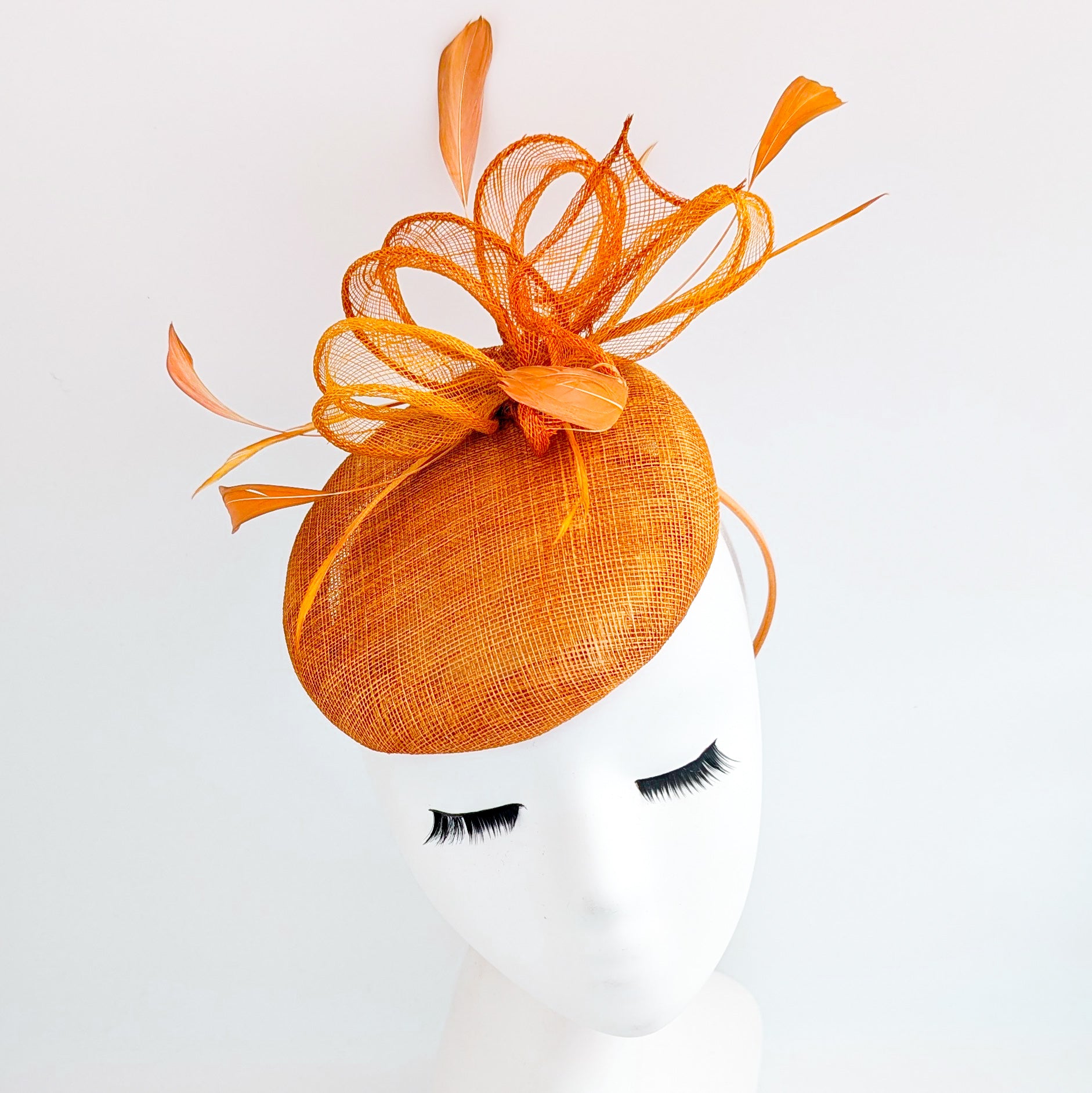 Burnt tangerine orange fascinator hat