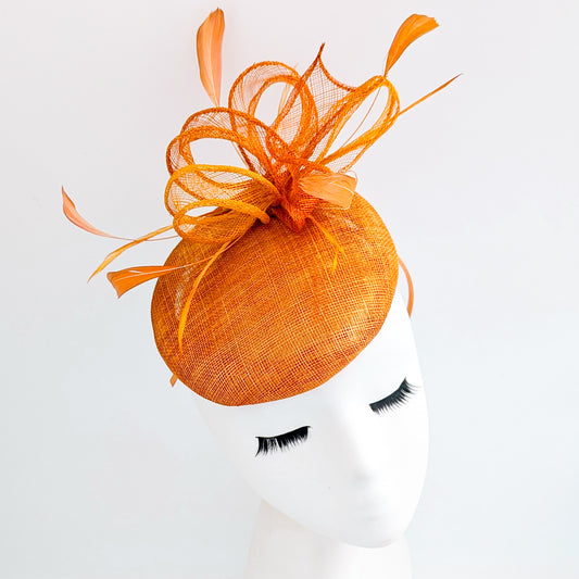 Burnt tangerine orange fascinator hat