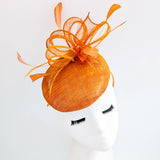 Burnt tangerine orange fascinator hat