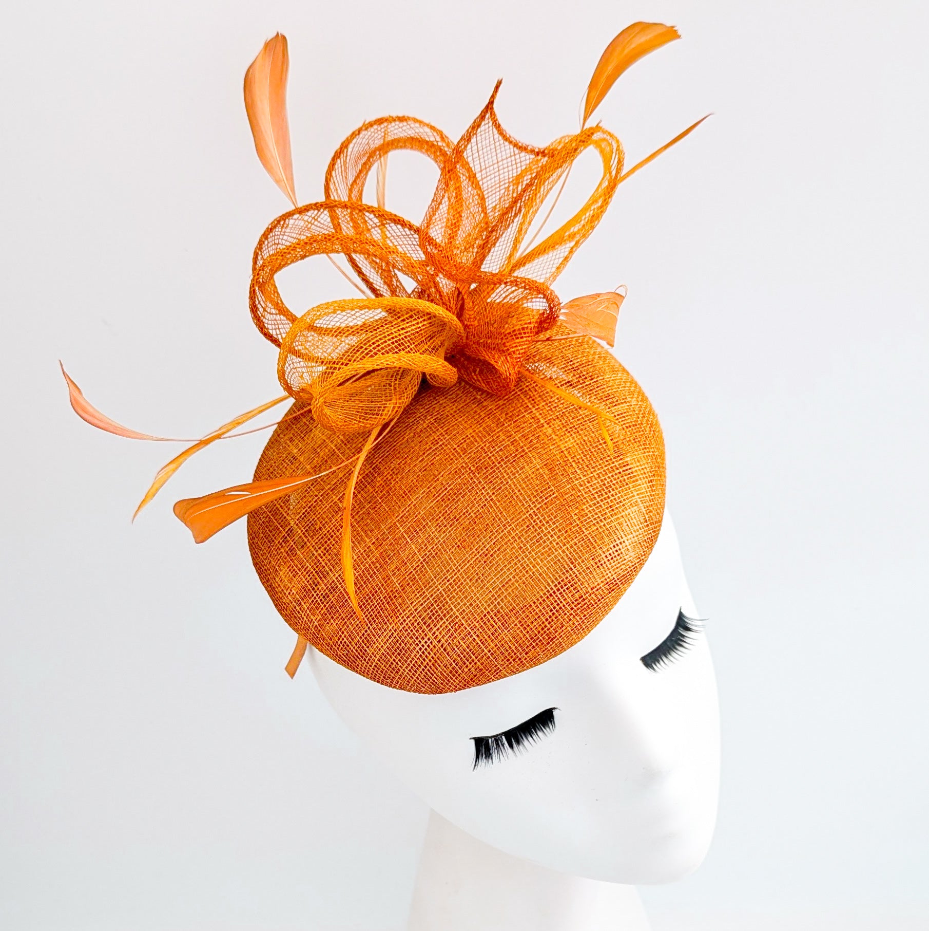 Burnt tangerine orange fascinator hat