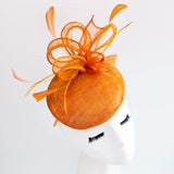 Burnt tangerine orange fascinator hat