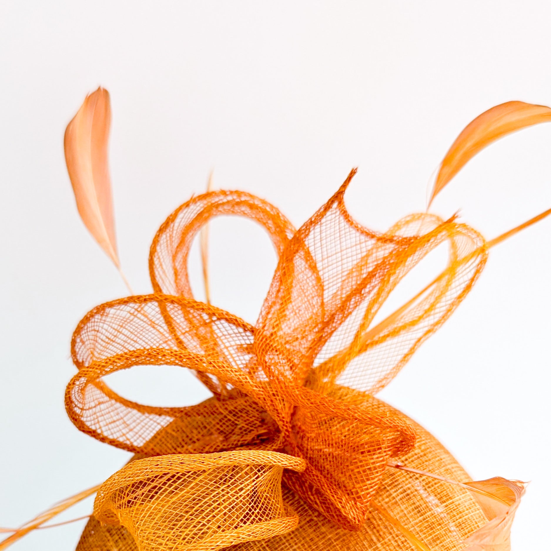 Burnt tangerine orange fascinator hat