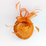 Burnt tangerine orange fascinator hat