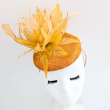 Tangerine orange feather fascinator hat