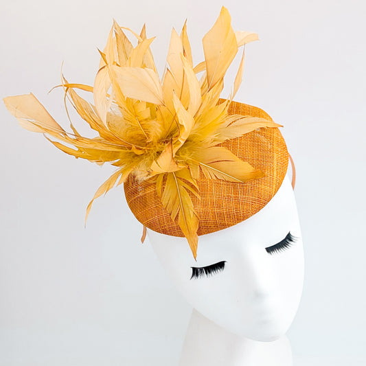 Tangerine orange feather fascinator hat