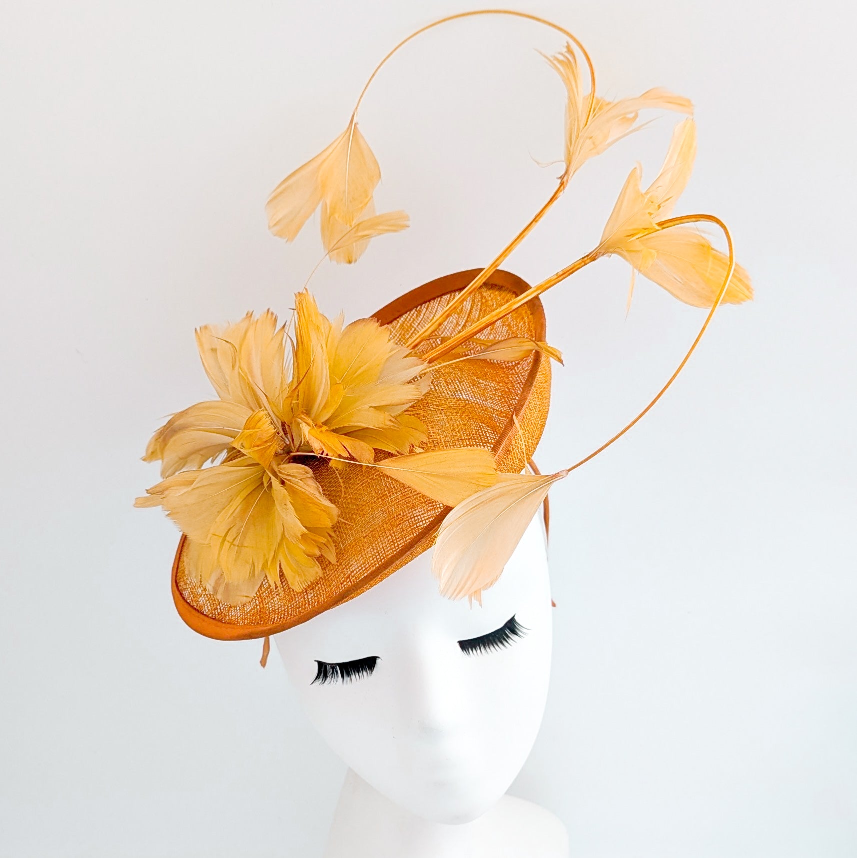 Tangerine orange feather disc fascinator hat
