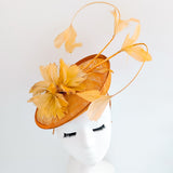 Tangerine orange feather disc fascinator hat