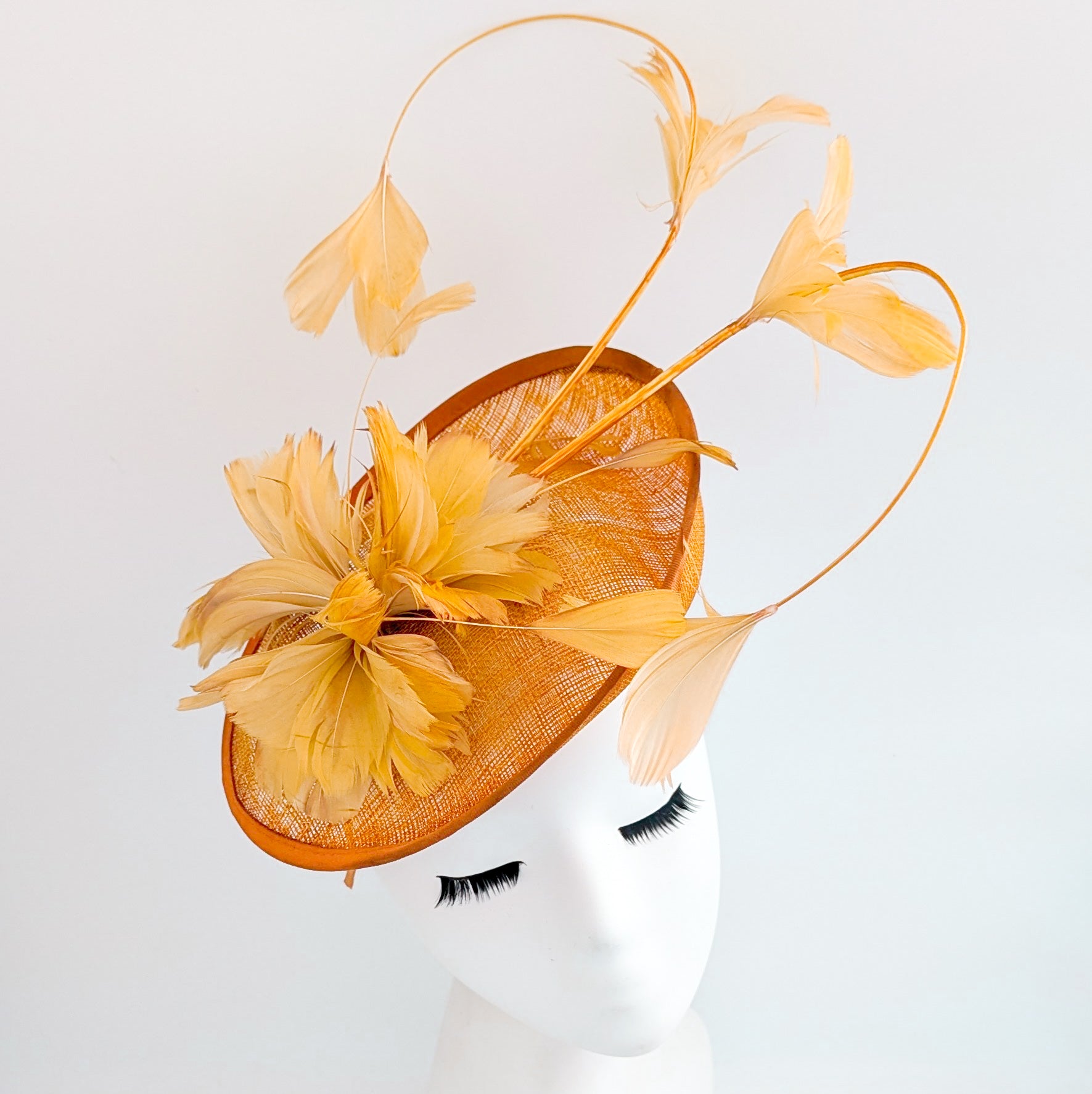 Tangerine orange feather disc fascinator hat