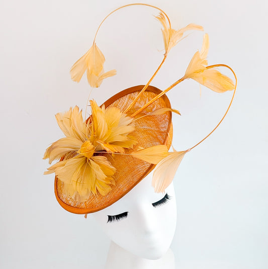 Tangerine orange feather disc fascinator hat