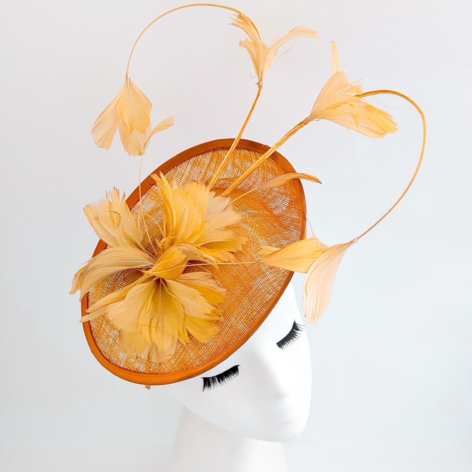 Tangerine orange feather disc fascinator hat