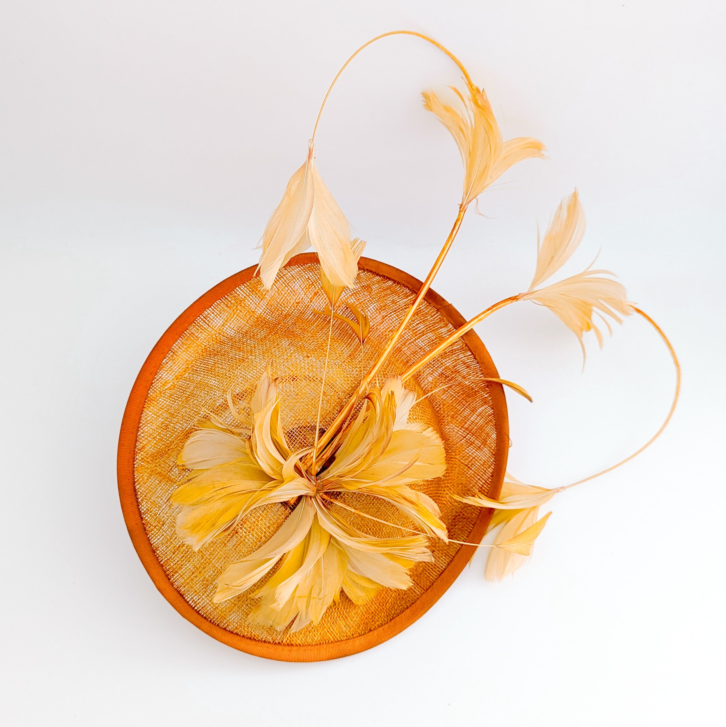 Tangerine orange feather disc fascinator hat