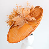 Terracotta dusty orange large feather oval disc fascinator hat