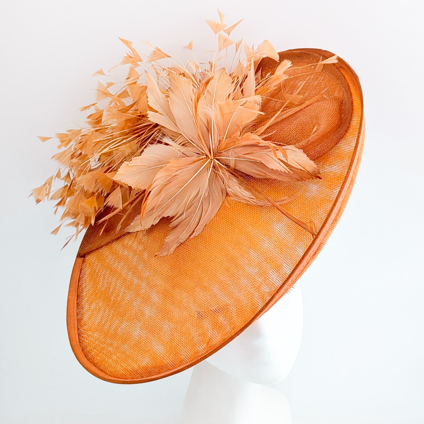 Terracotta dusty orange large feather oval disc fascinator hat